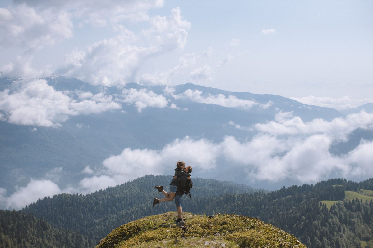 Couple looking over Himalayan mountain scenery