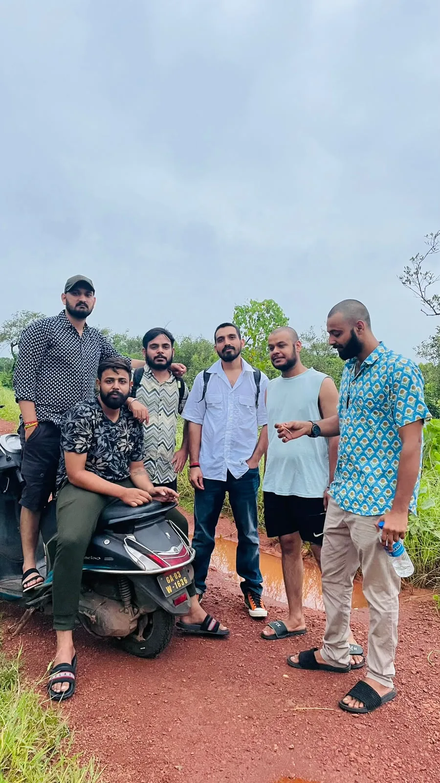 A group of friends gathered near the coast
