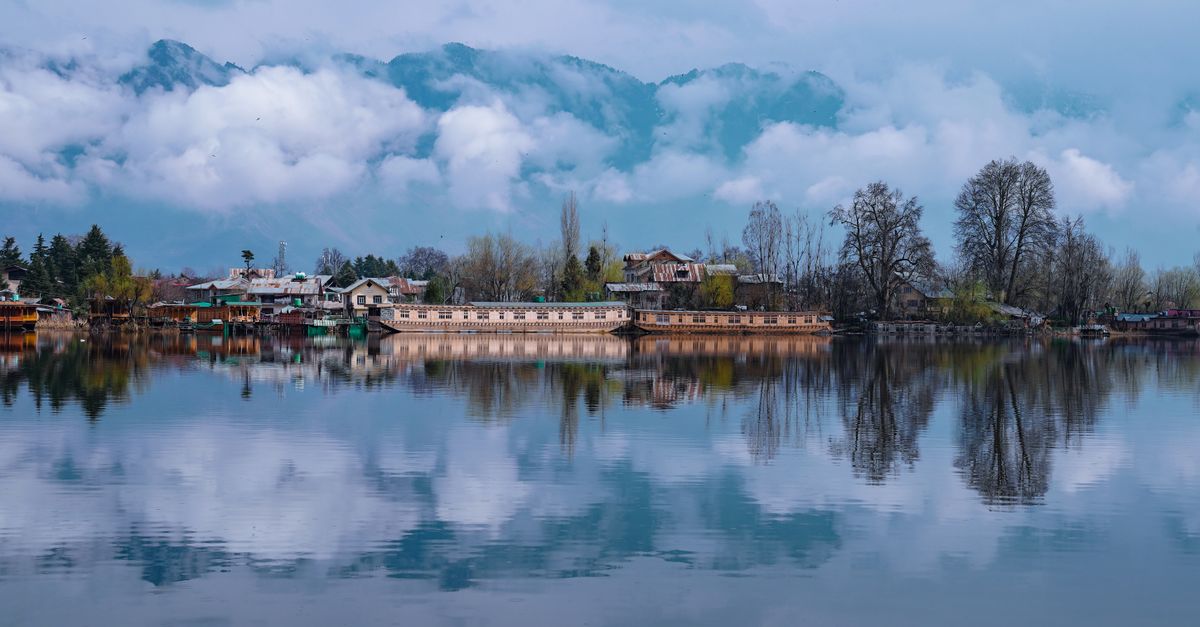 Houseboats and mountains on Dal Lake in Kashmir
